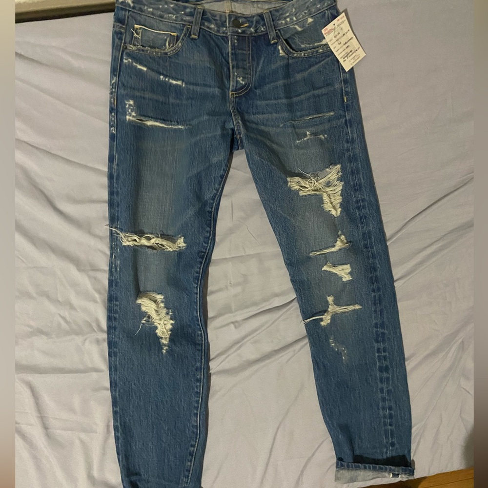 Women ripped blue skinny jeans